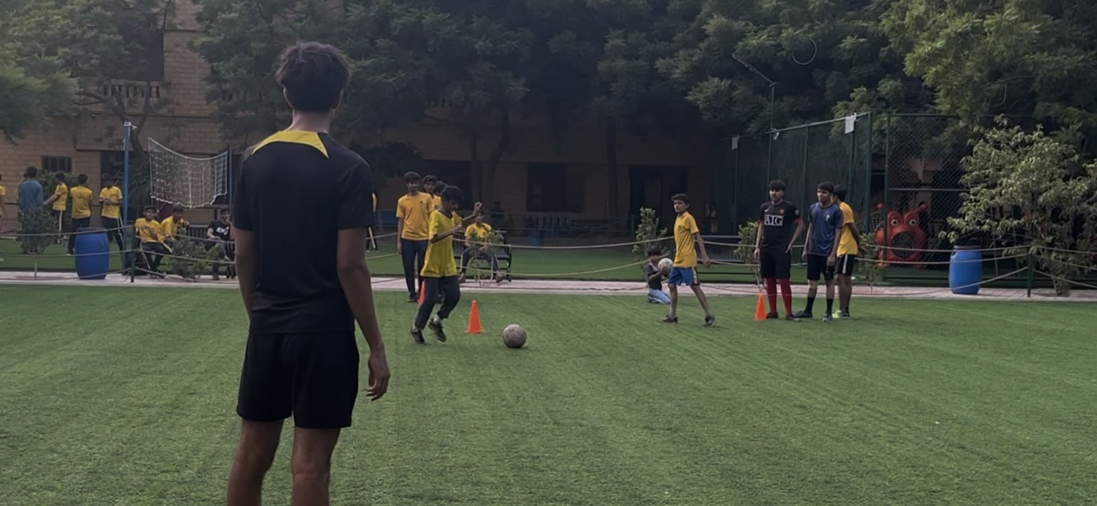 A drill on the NJV pitch, with cones and a ball between the players.